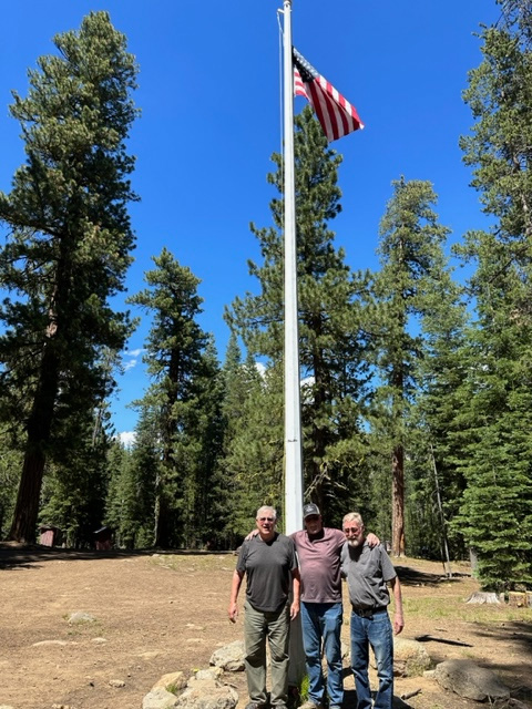 Raising the flag for the reunion at Camp Cottonwood. Robbie, Rich, and Richard, three members of their Boy Scout troop, after raising the flag for the reunion at Camp Cottonwood. The flag was from Robbie’s father’s funeral.